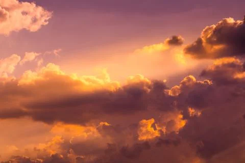 Sun rays through clouds like an dramatic explosion , power nature background. Stock Photos