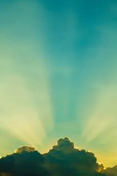 Sun rays through clouds like an dramatic explosion , power nature background. Stock Photos