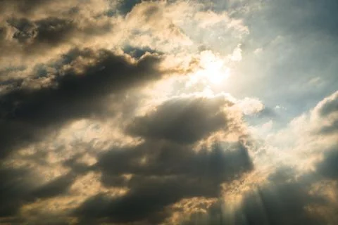 Sun rays through clouds like an dramatic explosion Stock Photos