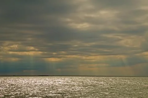 Sun rays through clouds on oregon inlet, north carolina Stock Photos