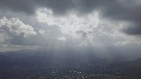 Sun Rays Through Clouds Over San Carlos de Apoquindo Stock Footage 338009025