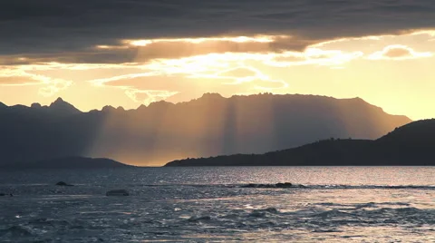 Sun rays through clouds at sunset Stock Footage 49090801