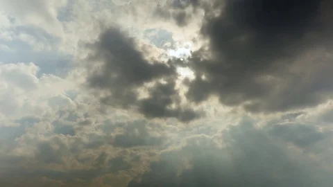 Sun rays through the clouds. Time-lapse recording. Footage 4K, UHD. Stock Footage 74302858