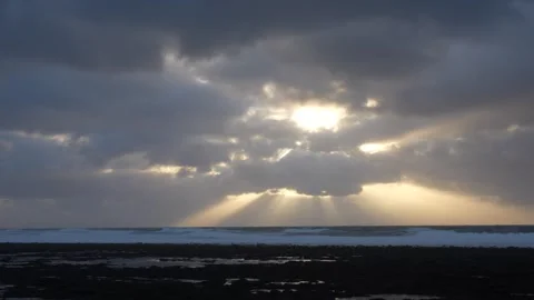 Sun rays through the clouds with wild seas in 4k Video stock 292684795