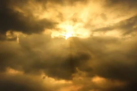 Sun rays through cloudy sky, hope or opportunity concept Stock Photos