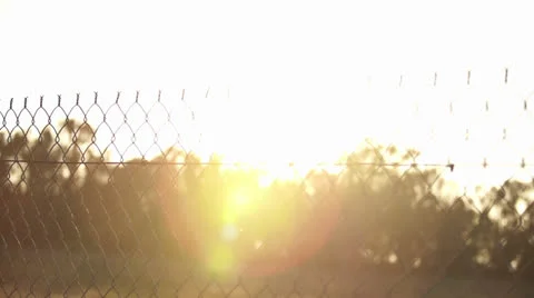 Sun Rays Through Fence Stock Footage 27200093