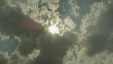 Sun rays through floating clouds. Time lapse Stock Footage 285896675