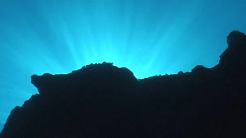 Sun rays thru surface of ocean with reef Video stock 106689136