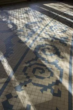 Sun rays on tiled floor Stock Photos