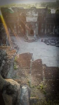 Sun rays from the top of a tower in Angkor Wat temple in Cambodia Stock Photos