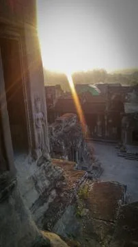Sun rays from the top of a tower in Angkor Wat temple in Cambodia Stock Photos