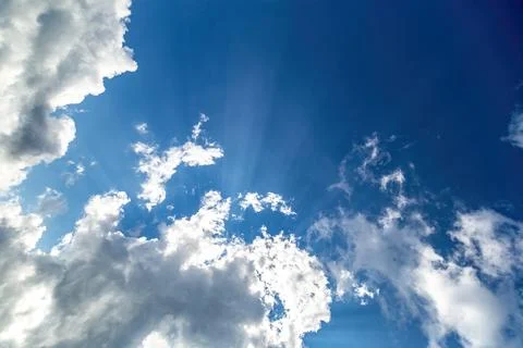 Sun rays from under the cloud Stock Photos