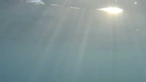 Sun rays underwater Stockbeeldmateriaal 127869171
