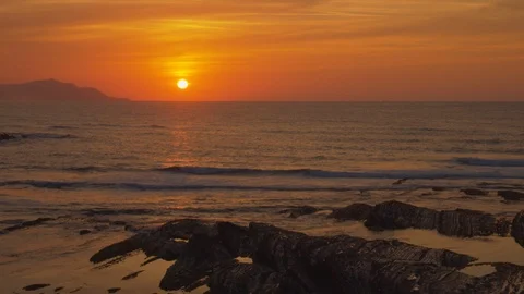 Sun in red sky falls on the marine horizon Stock Footage 112295378