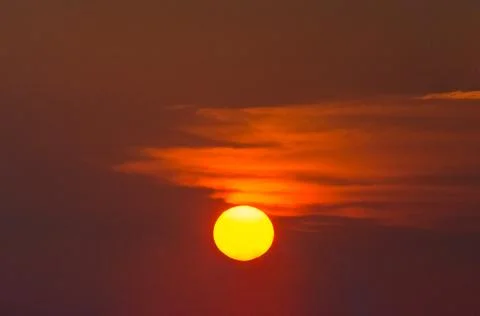 Sun in the red sunset sky Stock Photos