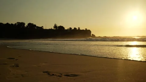 Sun reflected on the beach and sea and golden light at Sydney Coogee 6K Stock Footage 306645596