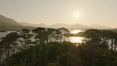 Sun Reflected Behind Pine Island and Distant Ridges, Drone Evening. Ireland R Stock Footage 342055245