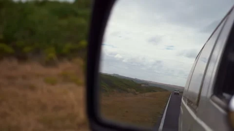 The sun is reflected in the mirror, evening road. View in the rear view side mir Stock Footage 294621370