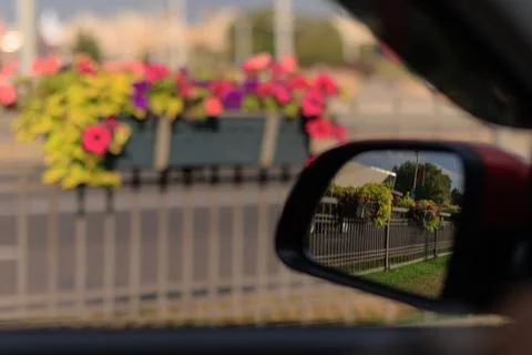 The sun is reflected in the mirror, evening road. Stock Photos