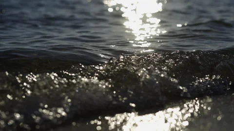 Sun reflected on sea water Stockbeeldmateriaal 213094768