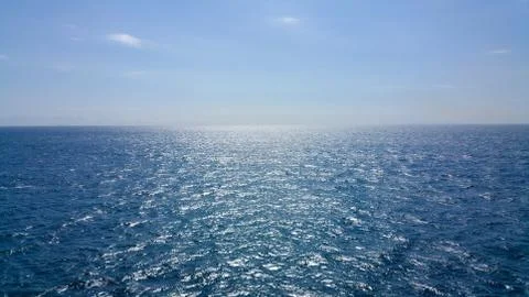 The sun reflected in the small waves. The shimmering waves in the sun Stock Photos
