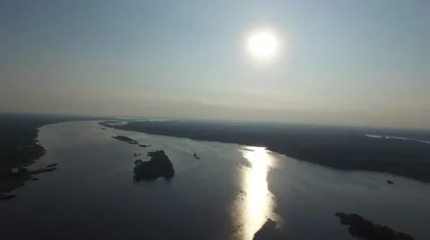 The sun reflected in the water of the great river. Aerial view. Stock Footage 66330672