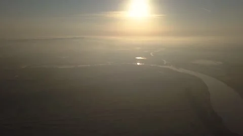 Sun Reflected in Water with Haze Early Morning 4K Stock Footage 149402561