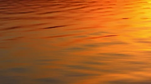 The sun is reflected in the waves of the sea during sunset and sunrise Stock-Footage 68916751