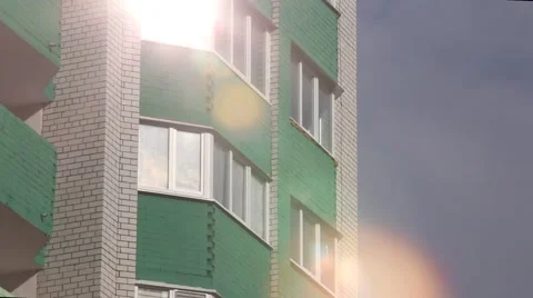The sun reflected in the window of a house Stock Footage 62802255