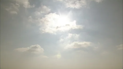 Sun reflecting on Mediterranean Sea with cliffs and human figure standing on Video stock 95600703