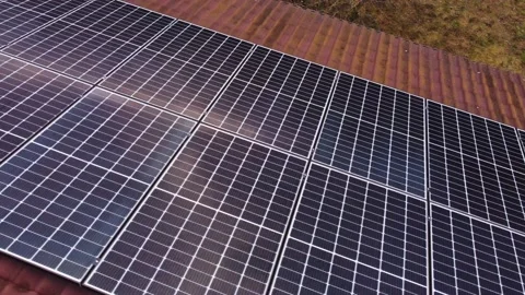 Sun reflecting of solar panels on privat... | Stock Video | Pond5