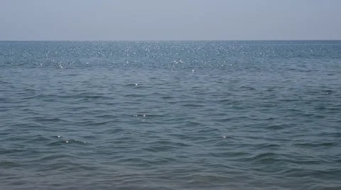 Sun reflecting on sparkling blue sea Stock Footage 66693473