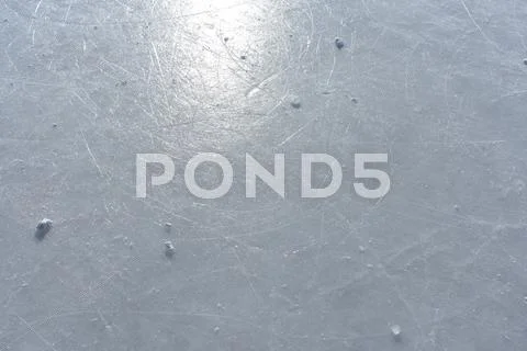 Sun reflecting in the surface of an ice rink Stock Photos