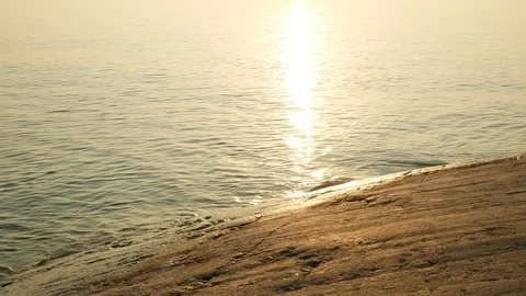 Sun reflecting in the water at the beach Stock Footage 97276764