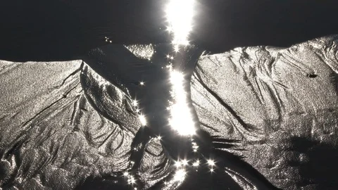 Sun Reflecting In Water Carving Through Sand Stock Footage 100609576