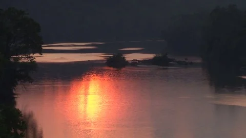 Sun reflecting on water during sunset Stock Footage 74096176