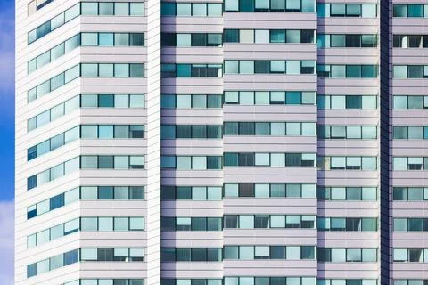 Sun reflecting in the windows of a white office Stock Photos