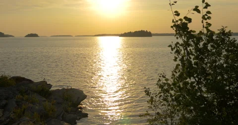 Sun reflection and calm waves in the lake at Killbear Provincial Park Stock Footage 58824995