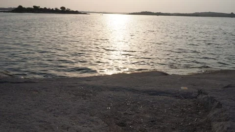 Sun Reflection on Lakeside Shore Stock Footage 335801977
