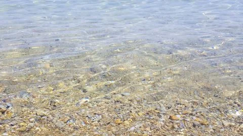 Sun reflection in shallow sea water, Skiathos island, Greece Stock Photos