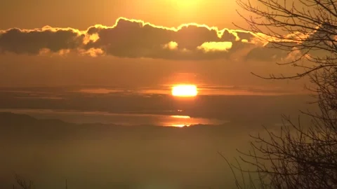 Sun reflection at sunset traveling horizontally over sea Stock Footage 158757947