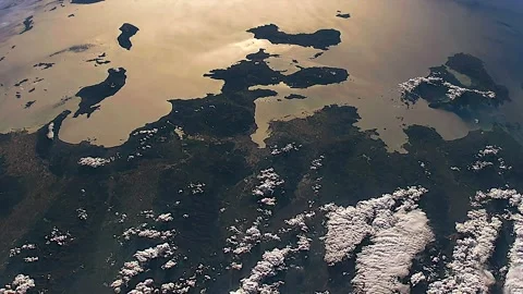 Sun Reflection on Surface of Planet Earth From Satellite in Space Stock Footage 159208366