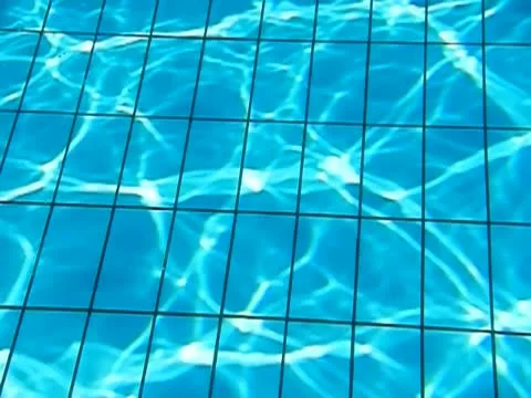 Sun reflection on tiles in pool. Slow motion. Stock Footage 12030808