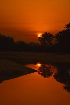 Sun reflection in water . beautiful landscape image of sunrise and sunset. Stock Photos