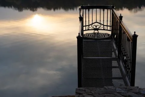 Sun reflection in water at sunset Stock Photos