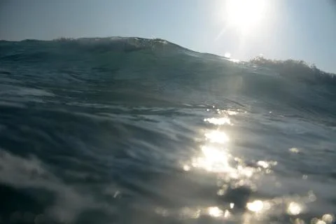 Sun reflection on a wave Stock Photos