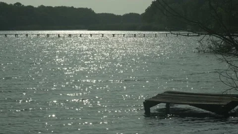 Sun reflections on the river water Stock Footage 235825619