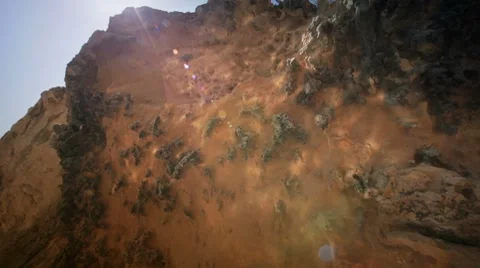 Sun reflections on a rock Stock Footage 7739963