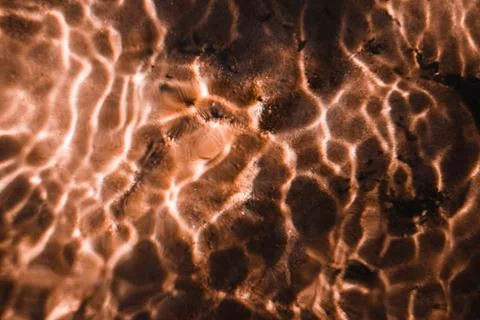 Sun reflections in a small creek Stock Photos