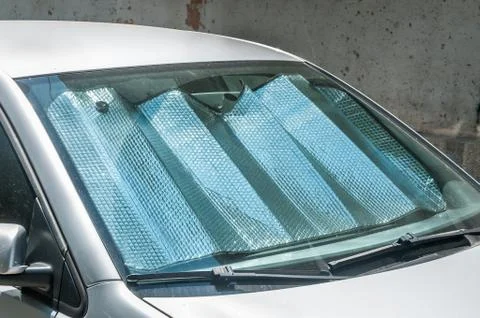 Sun reflector on the windscreen or windshield as protection of the car plastic Stock Photos